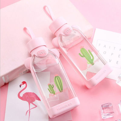 Garrafa de vidro bonito da forma do flamingo, garrafa de vidro cor-de-rosa com luva do silicone fornecedor