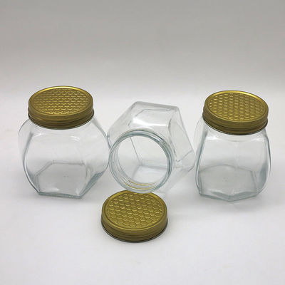 Frasco hermético seguro do mel do alimento transparente, frascos do vidro do hexágono do mel do armazenamento fornecedor