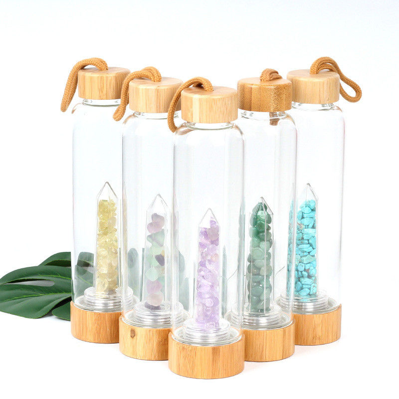 Garrafa de água de vidro redonda com ponto de cristal natural do cristal do elixir do centro de pedra preciosa fornecedor