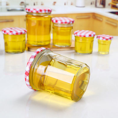 Vácuo de vidro do frasco do doce do projeto do cliente para redondo da tampa do parafuso do mel dado forma fornecedor